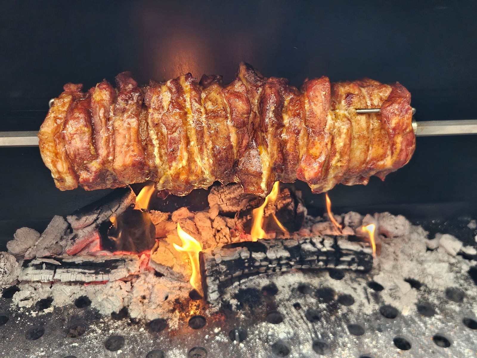 Live-fire rotisserie close-up