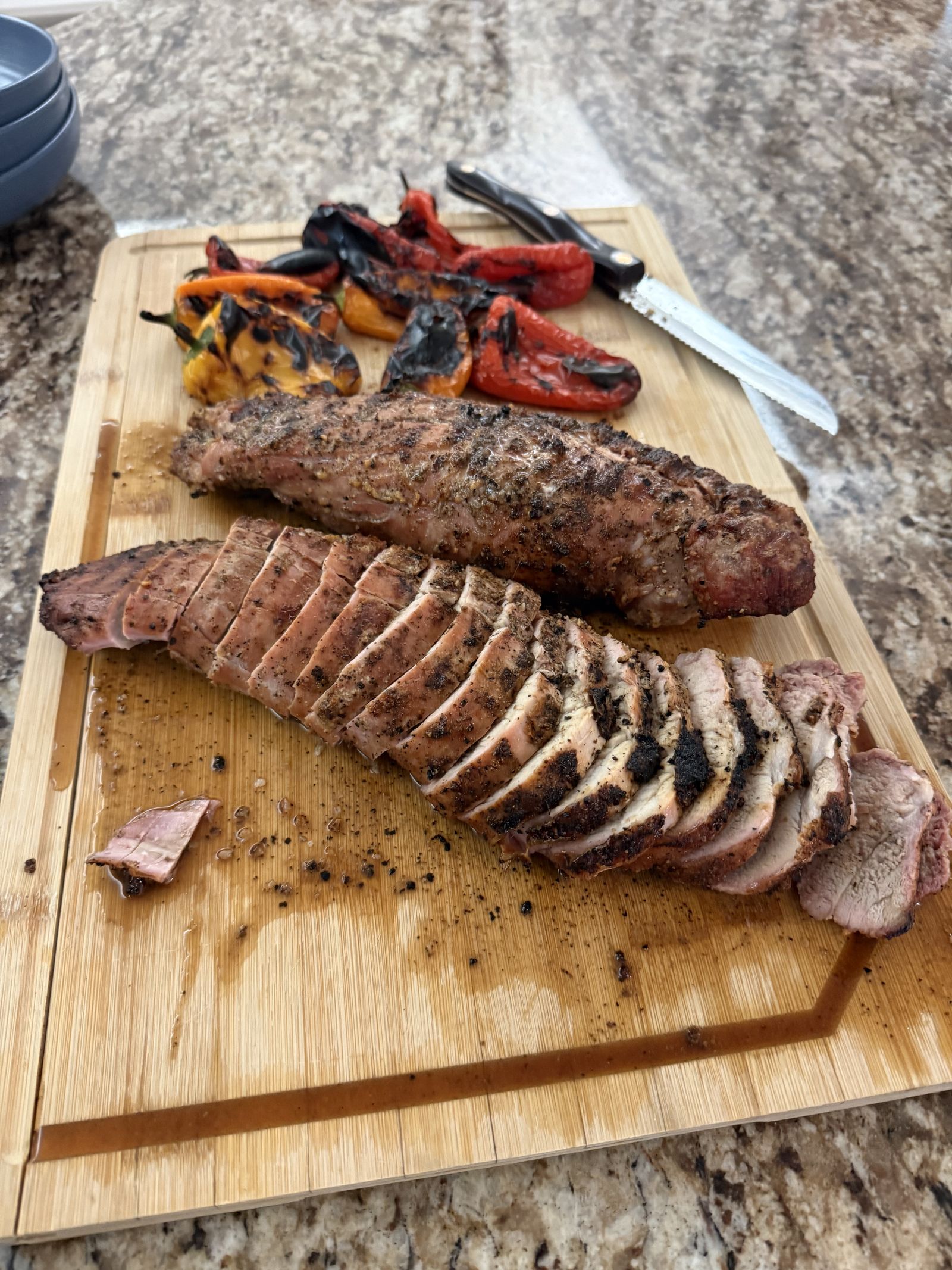 Sliced pork tenderloin with charred peppers