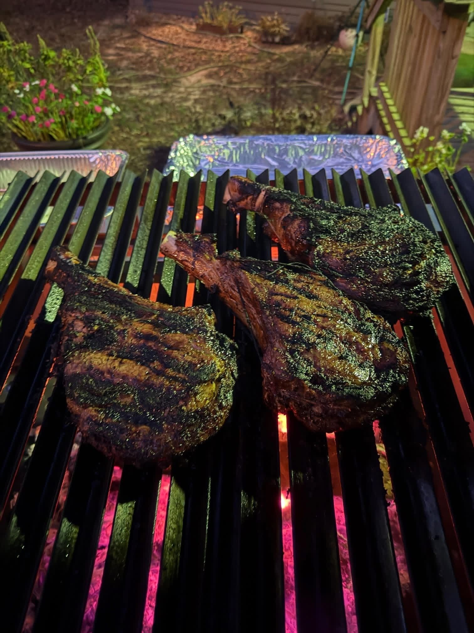 Tomahawk steaks over open fire