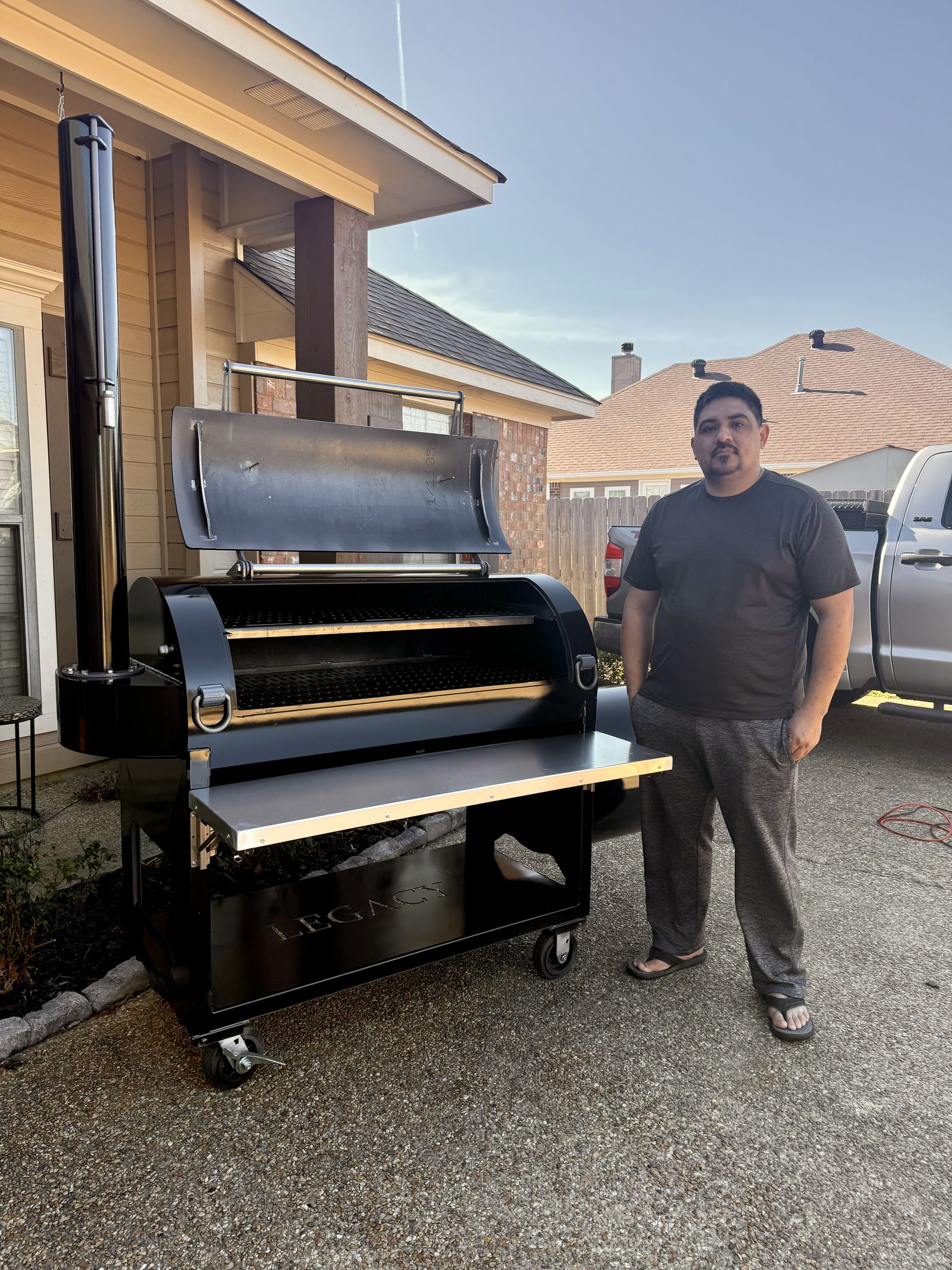 Customer with his black Legacy offset smoker